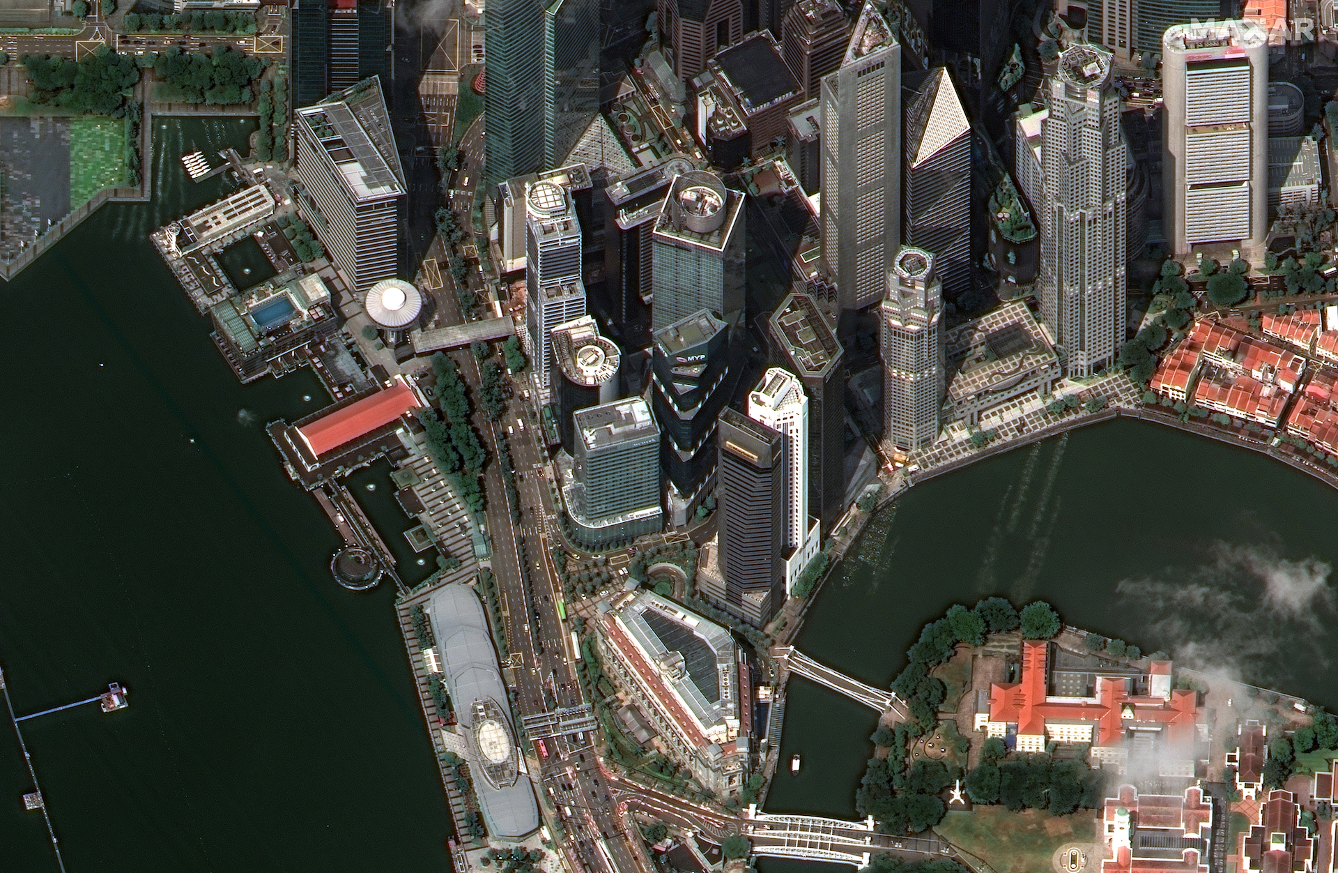 This 32-degree off-nadir WorldView Legion image of downtown Singapore demonstrates the agility of the new WorldView Legion satellites. At this angle, windows can clearly be distinguished, company logos can be read, and the number of stories can be counted on the sides of skyscrapers. The famous Fullerton Hotel Singapore is in the foreground of the image.