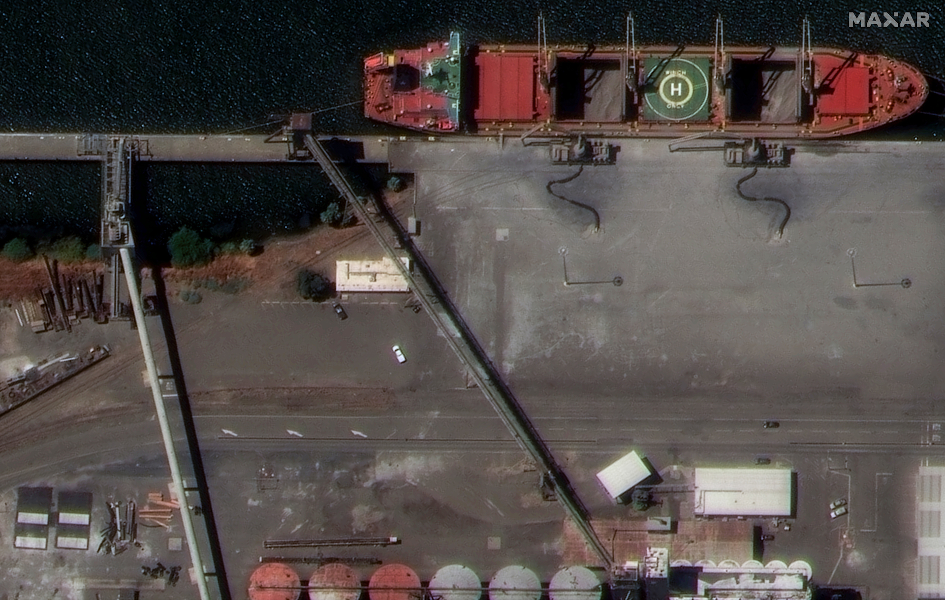 This WorldView Legion image shows a bulk carrier ship docked in Washington Lake, next to the Sacramento River Deep Water Ship Channel. You can identify that the ship has two cargo holds open and see the current equipment in use for port operations—examples of important details in site monitoring missions.