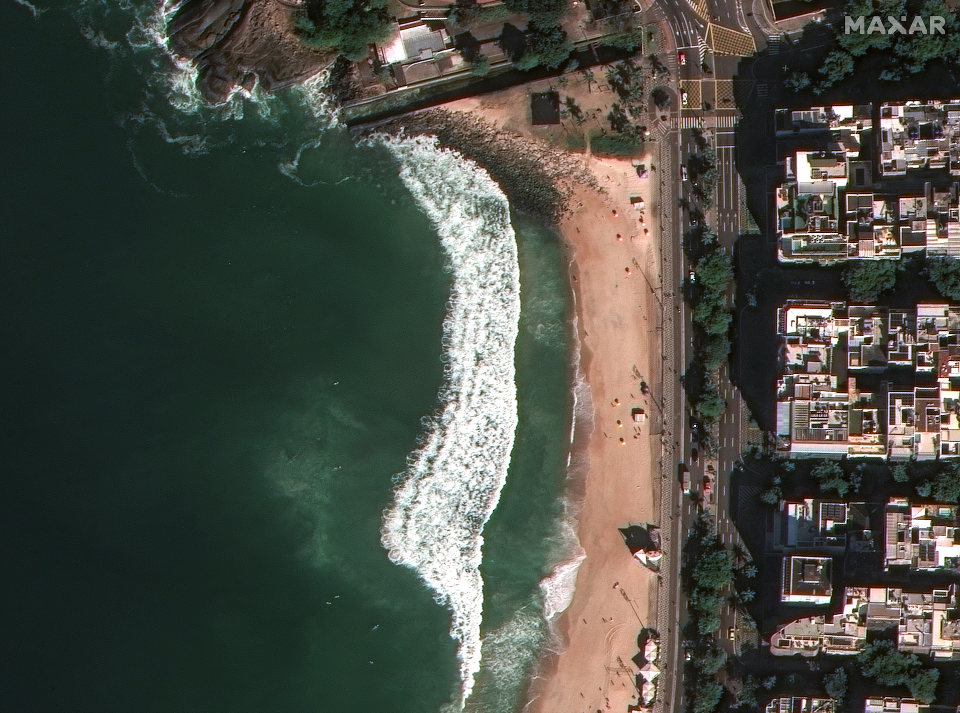 WorldView Legion collected an image of surfers catching waves while people stroll along Leblon Beach in Rio de Janeiro, Brazil. Crosswalks, road markings and bike lanes are visible in paint while pedestrian walkways are defined by the area’s famous mosaic sidewalks. 