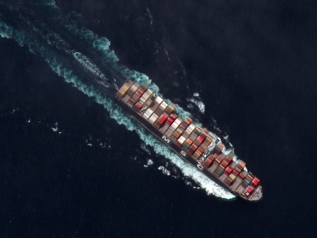 satellite image of a cargo ship on the water